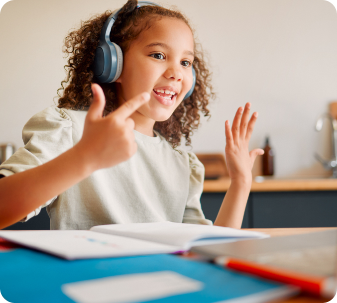 Girl wearing headphones counts with her fingers to demonstrate newfound math skills during her tutoring session.