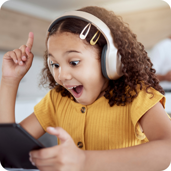 Student wearing headphones is excited during virtual math tutoring session.