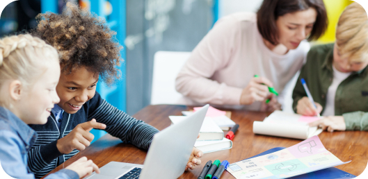 Two groups of students work in a blended classroom model of virtual math tutoring.